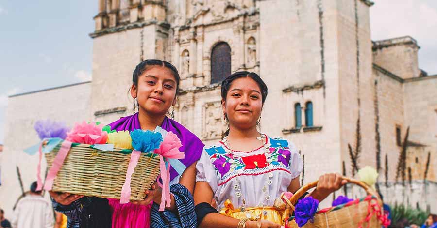 Mexican girls holding basket